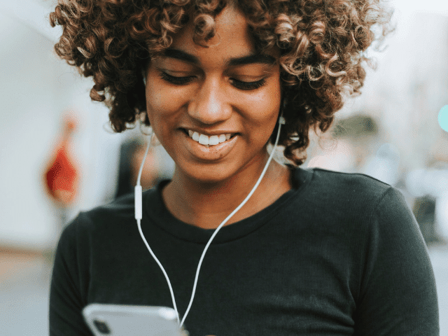 Benefits of Blog black woman looking at phone