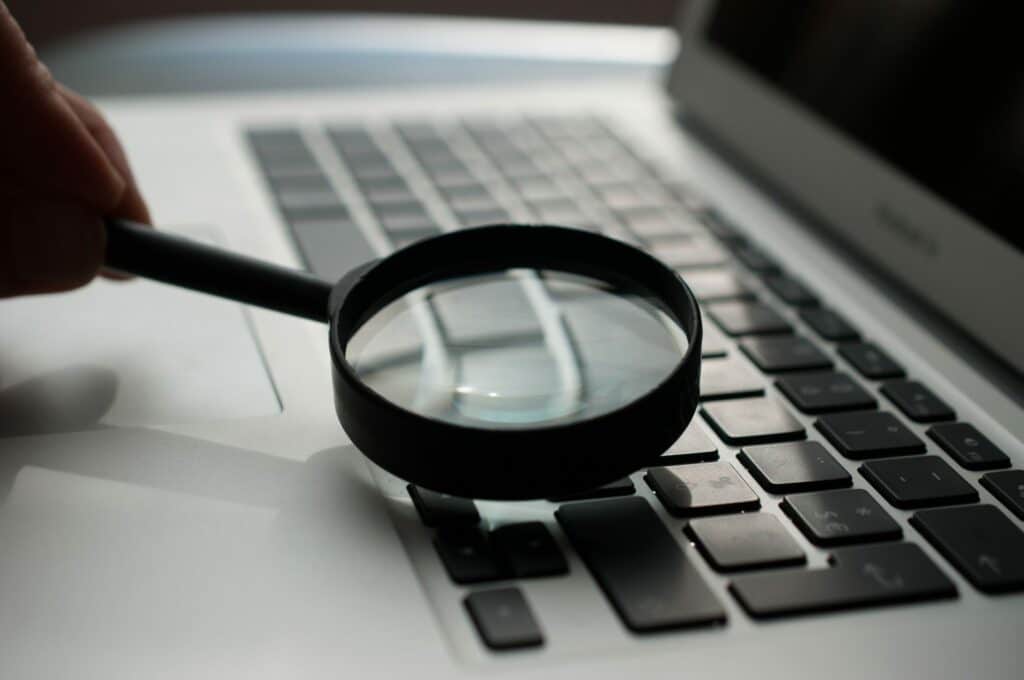 Keyword research and analysis with black magnifying glass