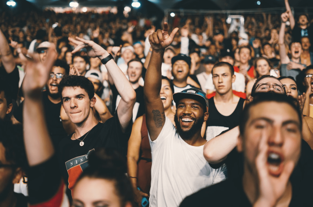 crowd cheering about grassroots strategy for marketing