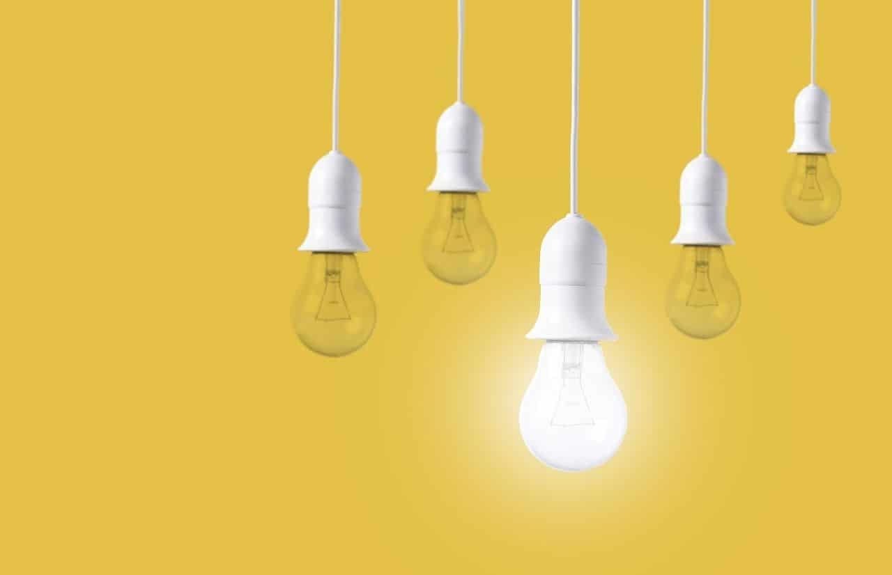 Best Tools for Digital Marketing Agencies yellow light bulbs with one lit white bulb