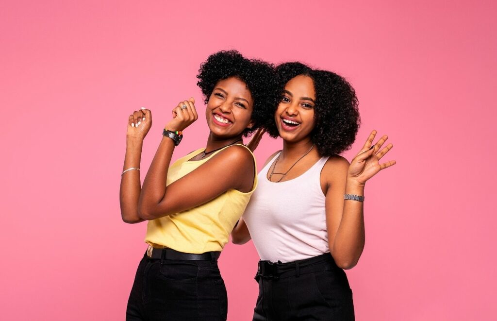 How to Optimize Your Blog Post for SEO two black lady blogger influencers posing together. Keep reading to learn how to convert social media into sales.