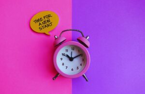 11 Best Keyword Discovery Tools to Rank Blog Post Quickly with Pink Clock on Pink and Purple Background