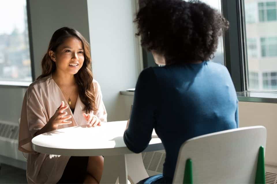 Business Owner interviewing customer to learn what to put in case study