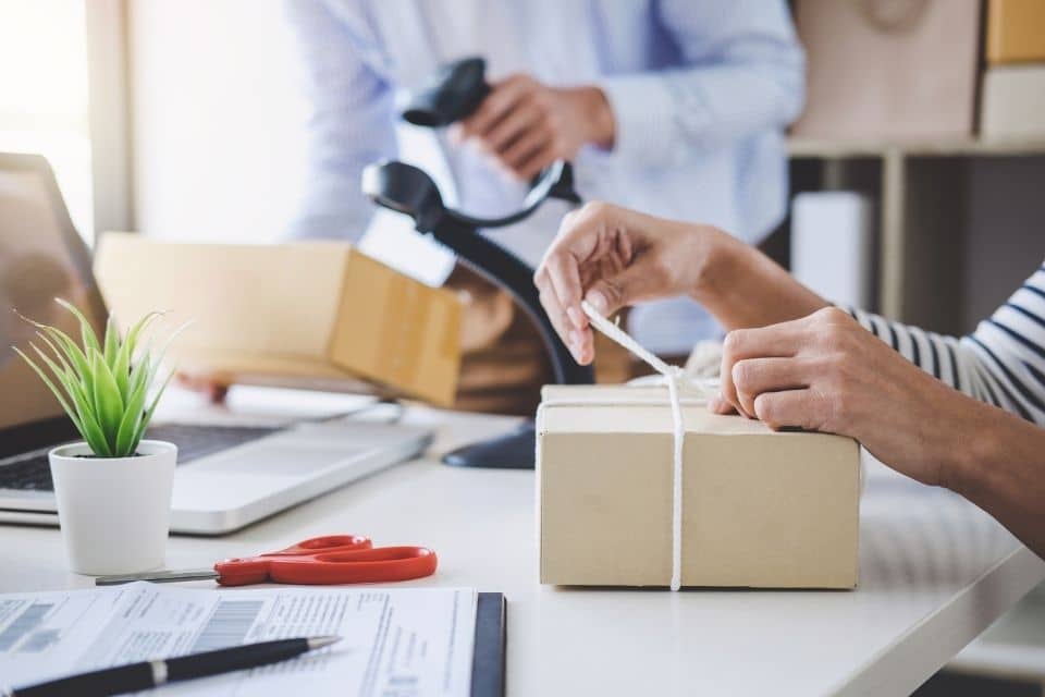 Small Business owner packing up products to mail