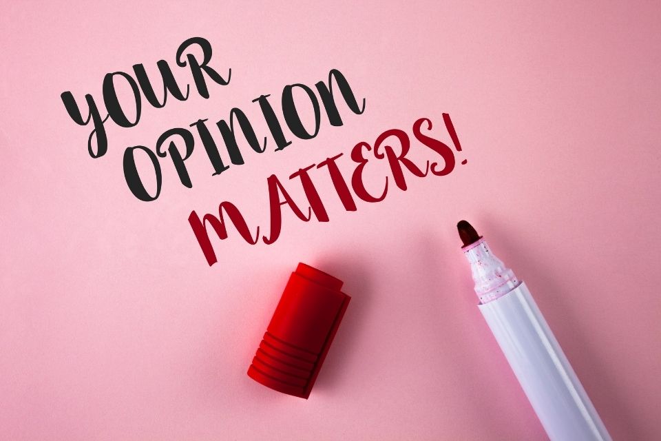 Your opinion matters written in black and red on pink background