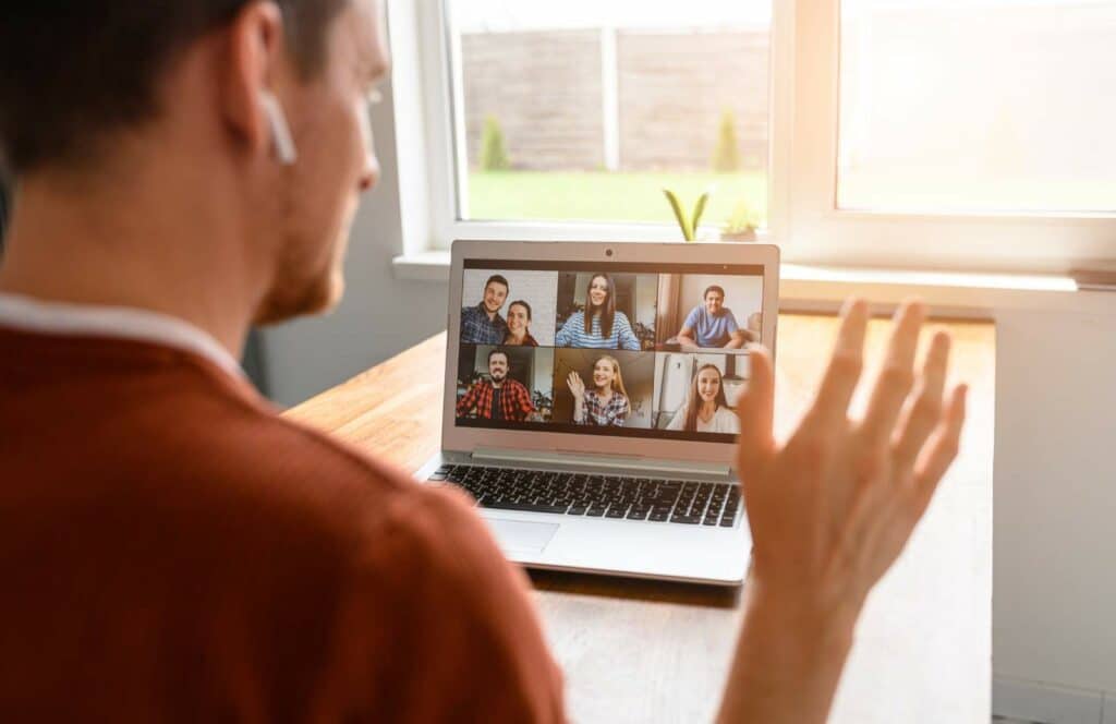 A man sitting at his desk hosting a virtual summit from his blog audience. Keep reading to learn how to monetize your blog from day one because content is king.