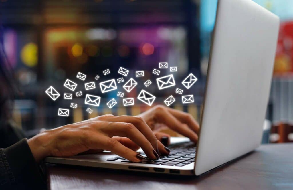A woman doing email marketing on her computer so she can monetize her blog from day one. Keep reading to learn the answer to the question, "Is Blogging Still Relevant?"