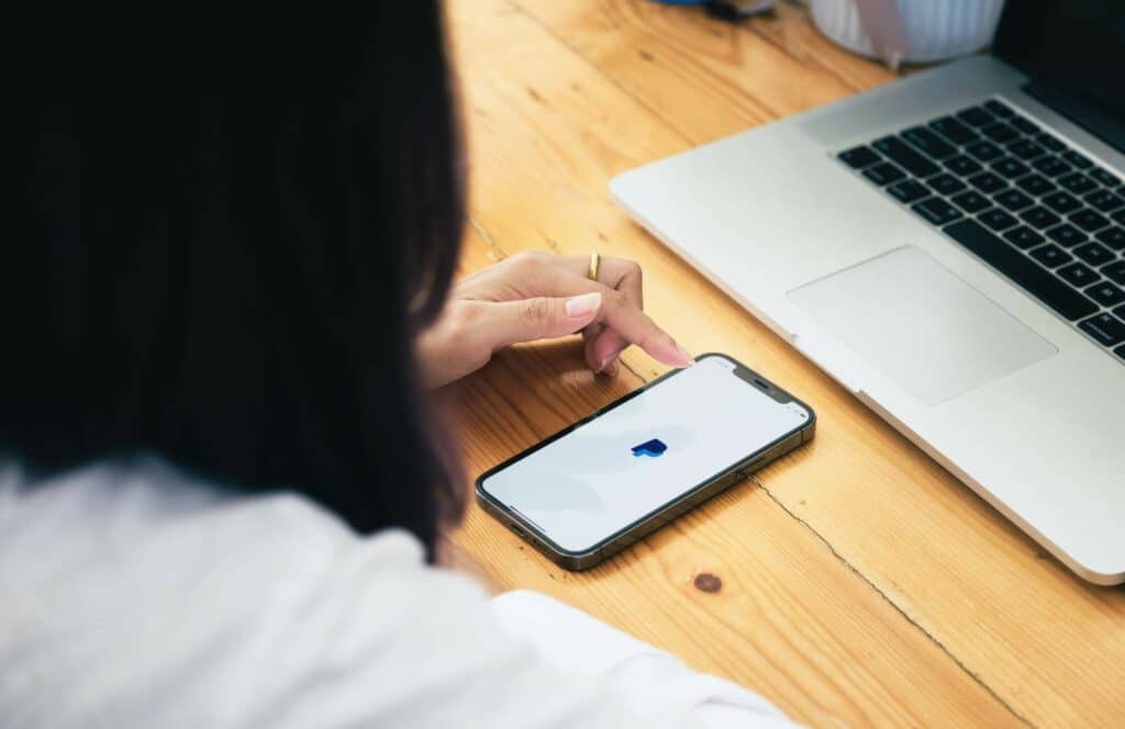 A woman logging into Paypal so she can make a donation to her favorite blogger. Keep reading to learn how to monetize your blog from day one.