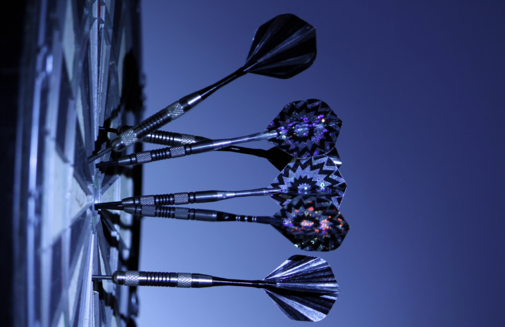 A board with darts symbolizing how bloggers should focus on creating valuable content for a target audience. Keep reading to learn the answer to the question, "Is Blogging Still Relevant?"