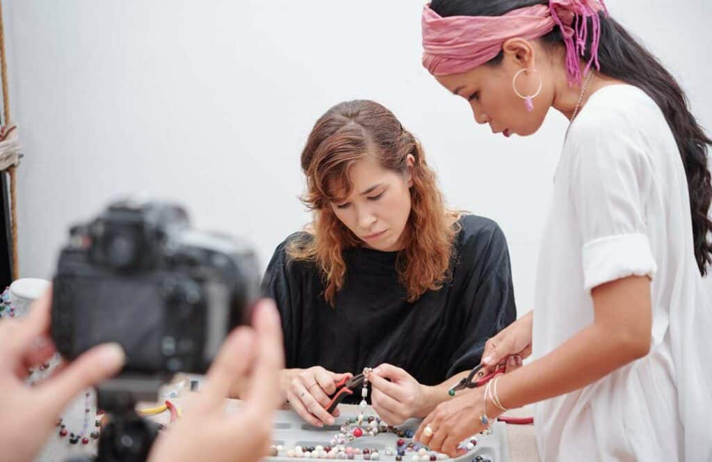 Two women working with beaded jewelry for a craft blog. If you have ever asked "What's the point of blogging?" click here to read more.