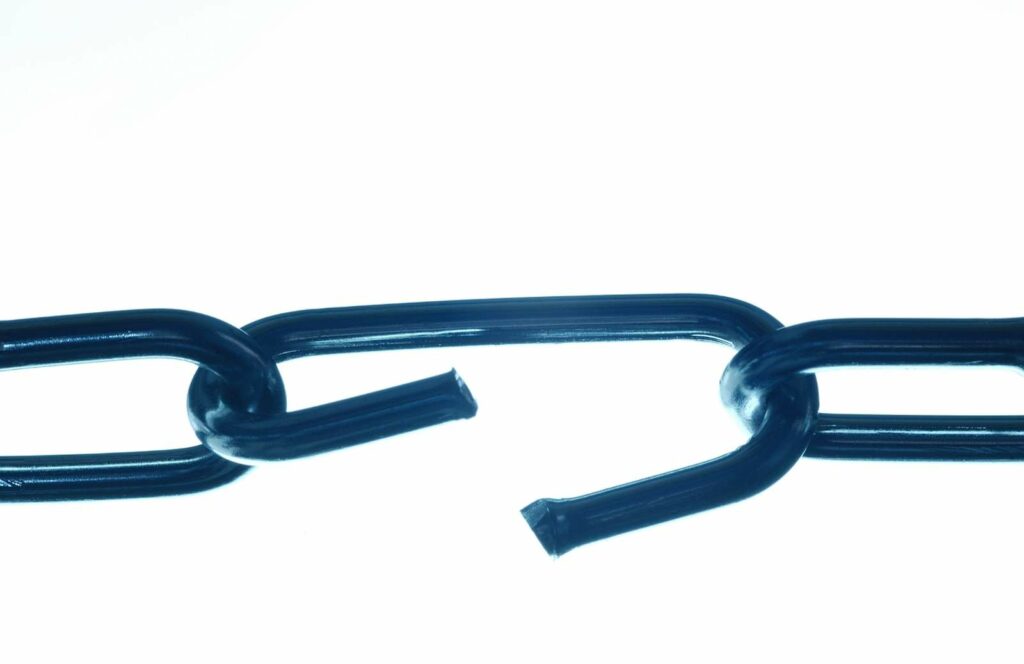 A broken link of a blue steel chain. Learn more about internal linking best practices by reading this blog post.