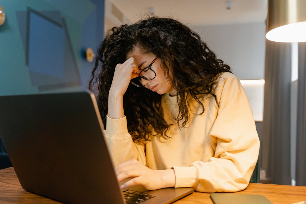 A Tired Woman using a Laptop. Learn more about the future of Blogging here.